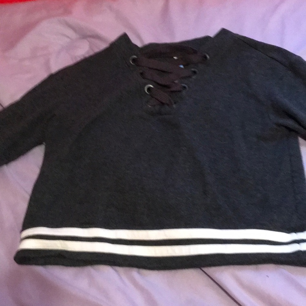 This is a girls crossed sweatshirt